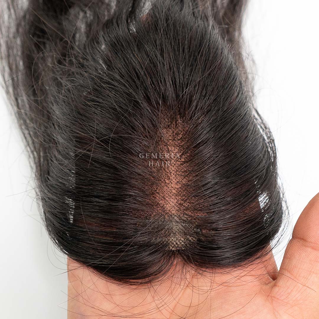 top view of full mono essential hair topper, measuring 1.5x3 inches, showcasing its natural texture and color.